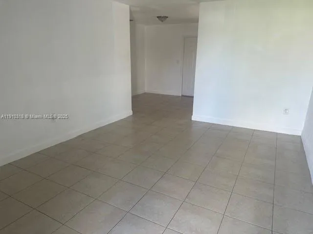 an empty room with white door