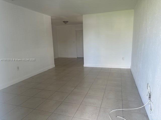 7571 Venetian Street, Unit C Miramar, FL 33023 - Photo 3 of 6 an empty room with white door