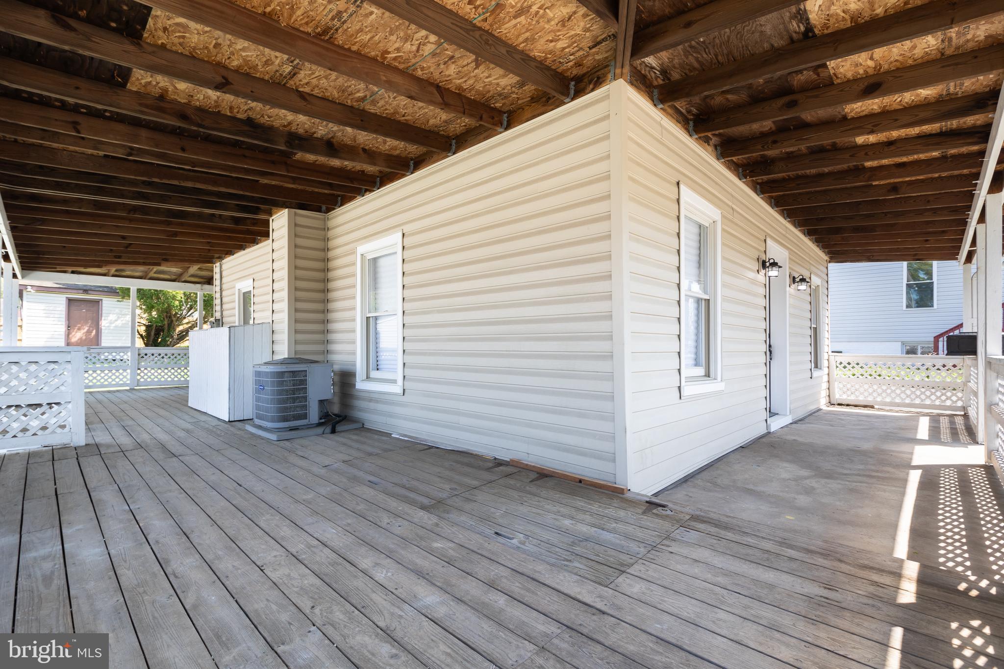 2407 Hammonds Ferry Road Halethorpe, MD 21227 - Photo 4 of 43 a view of a porch with wooden floor