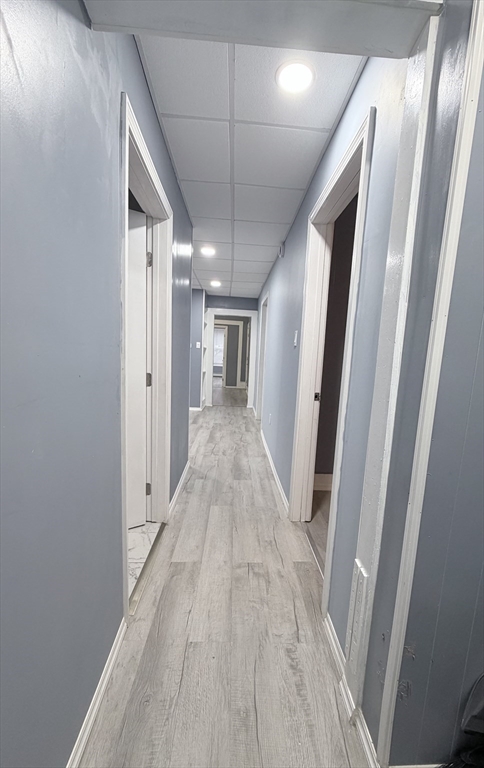 143 Cambridge Street, Unit 2 Worcester, MA 01603 - Photo 8 of 9 a view of a hallway with wooden floor