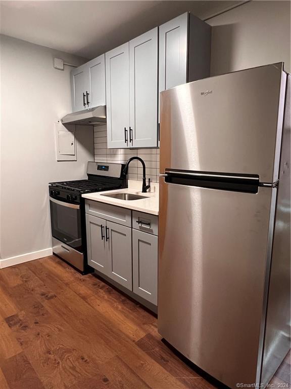 a white refrigerator freezer sitting in a kitchen