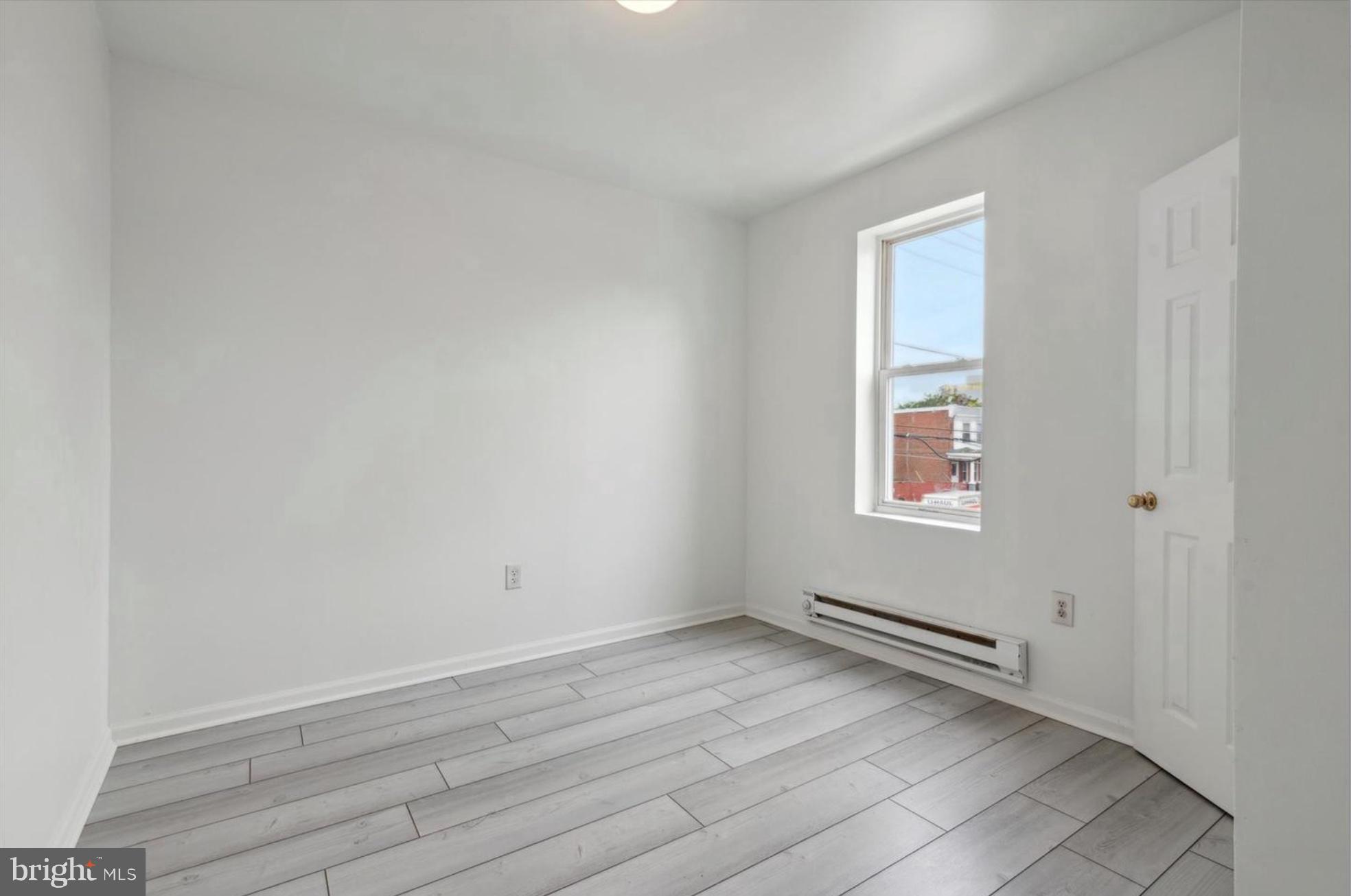 59 North 59th Street Philadelphia, PA 19139 - Photo 12 of 15 a view of a room with wooden floor and window