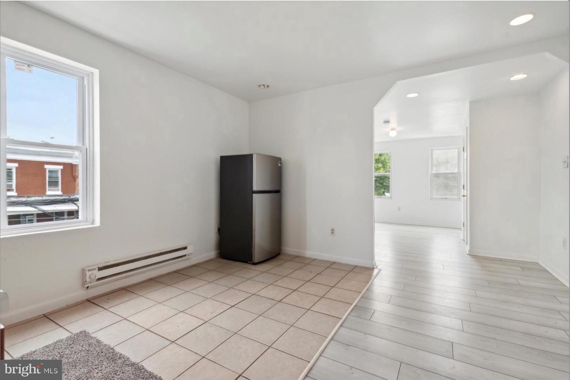 59 North 59th Street Philadelphia, PA 19139 - Photo 8 of 15 a view of an empty room with wooden floor and a window