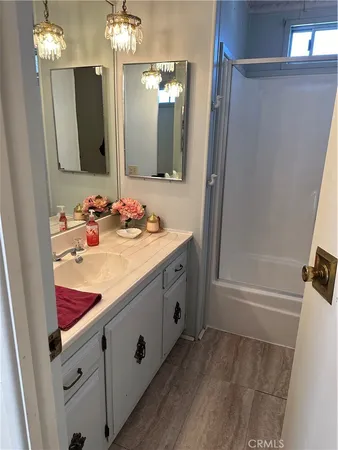 a bathroom with a double vanity sink and a mirror