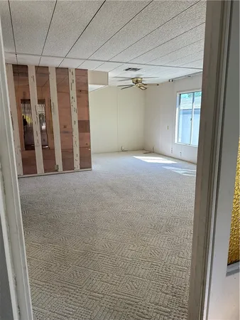 a view of an empty room with a window