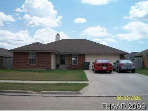 a view of a car in front of a house