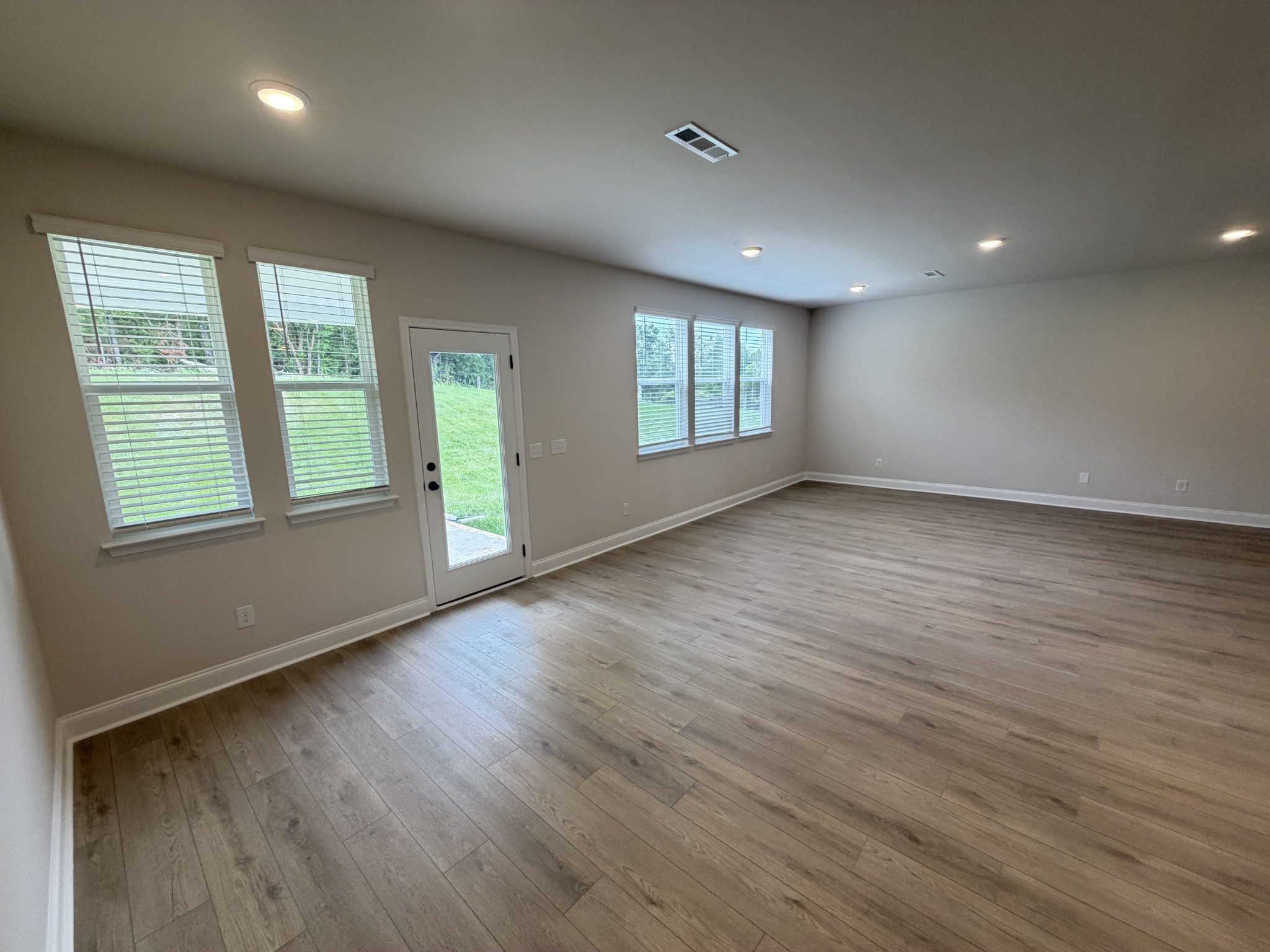 147 Emeline Way Mount Juliet, TN 37122 - Photo 3 of 41 an empty room with wooden floor and windows