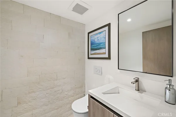 a bathroom with a shower and mirror