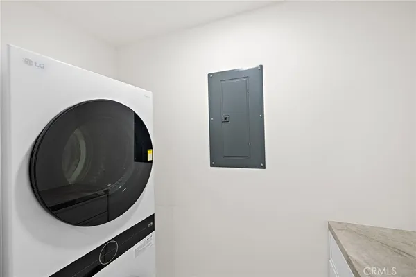 a balcony with furniture and potted plants