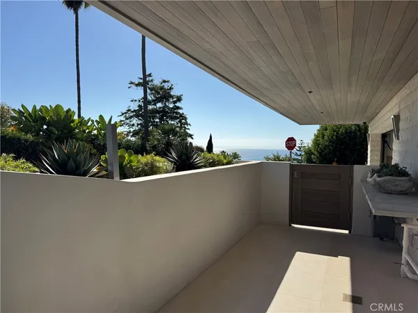 a view of a table and chairs in the patio