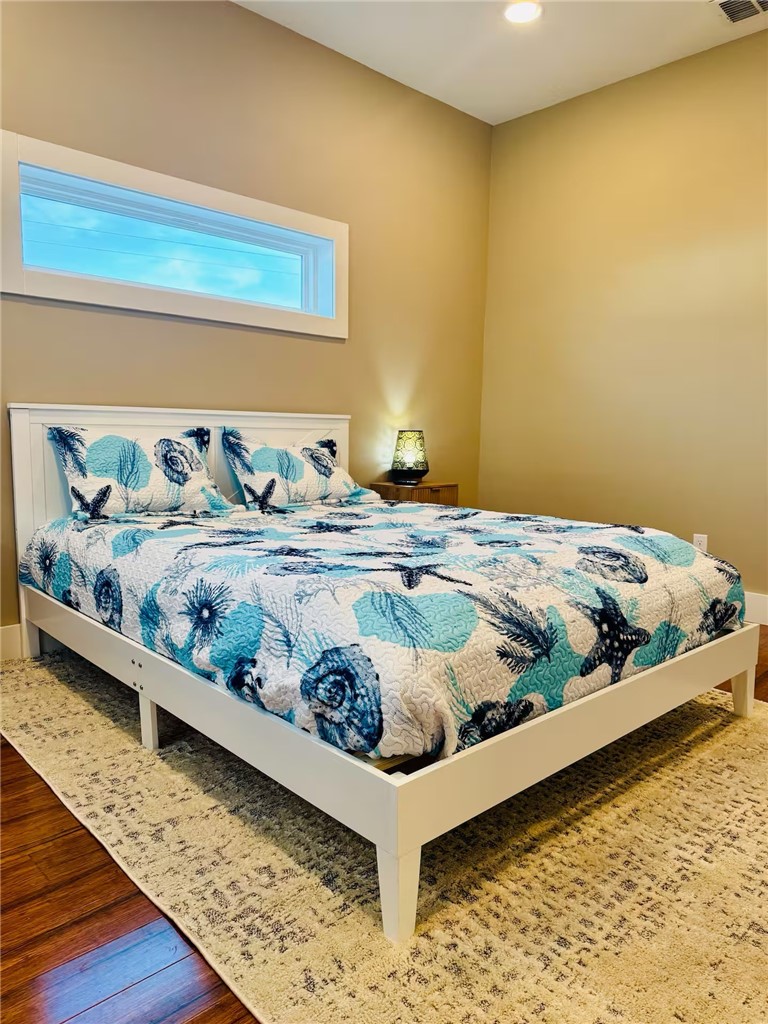 14310 Ridley Way Corpus Christi, TX 78418 - Photo 16 of 19 a bedroom with a bed and painting on the wall