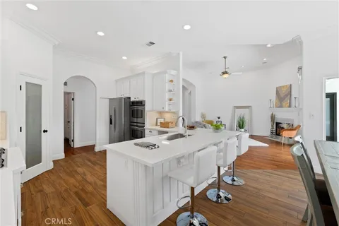 a view of a dining room with furniture and wooden floor