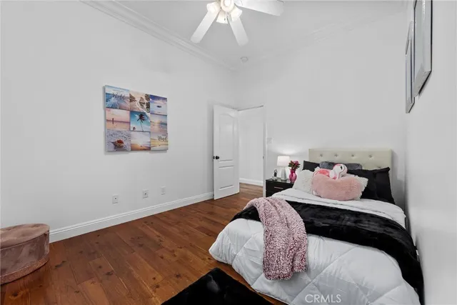 a view of a patio with a table and chairs under an umbrella