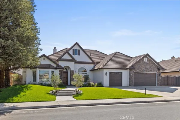 a view of house that has a yard