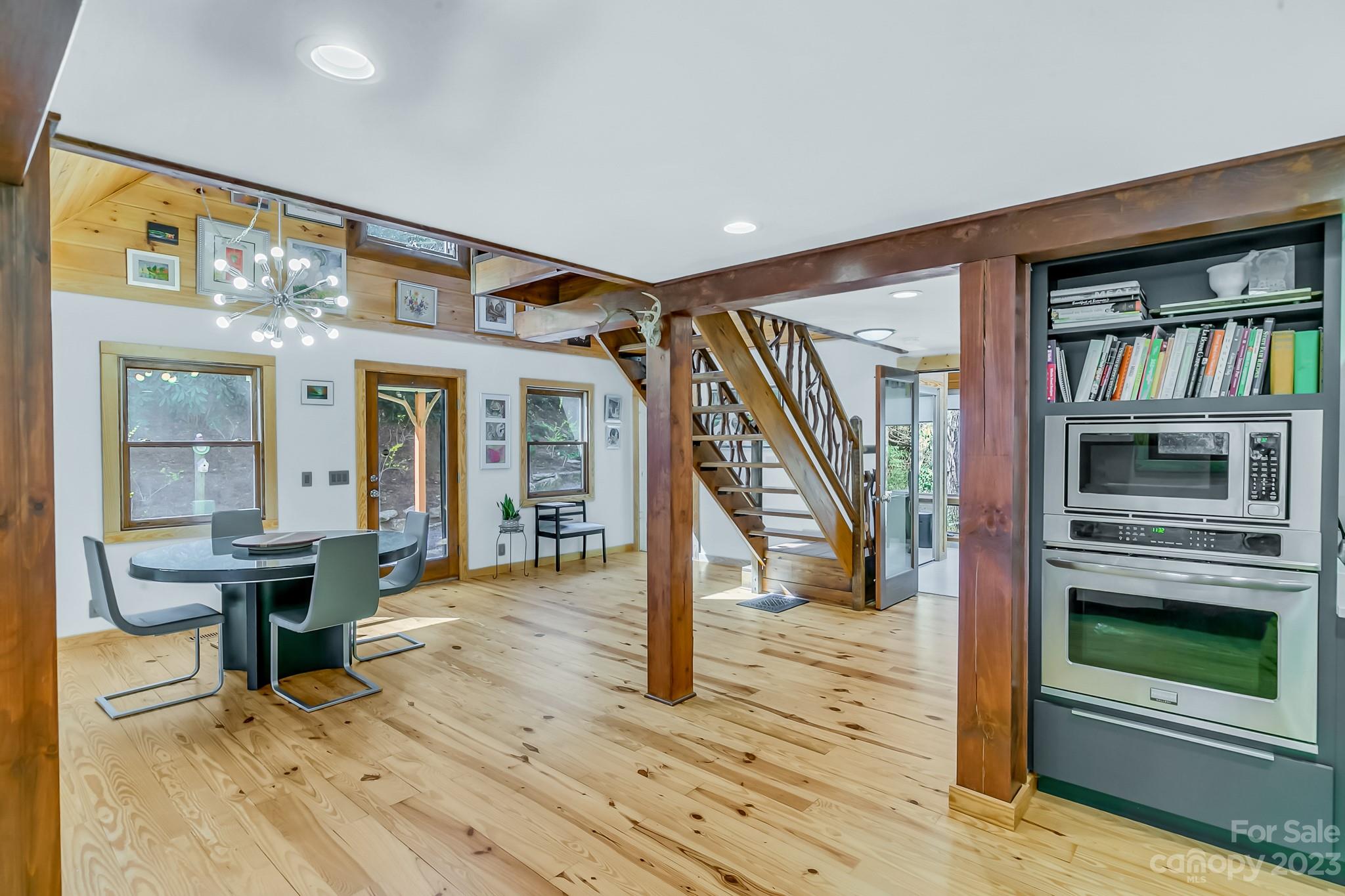449 Old Powell Road Brevard, NC 28712 - Photo 11 of 48 a view of a livingroom with wooden floor and furniture