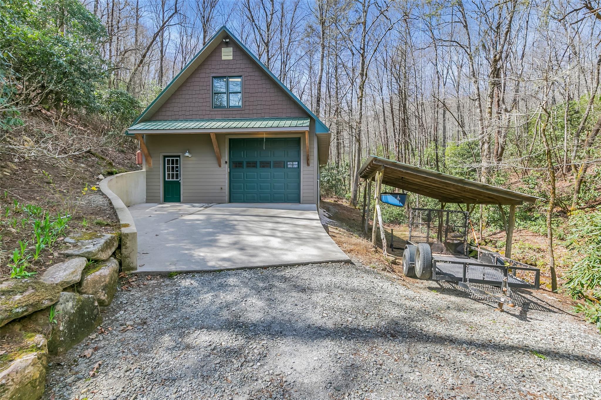 449 Old Powell Road Brevard, NC 28712 - Photo 32 of 48 a front view of a house with garden