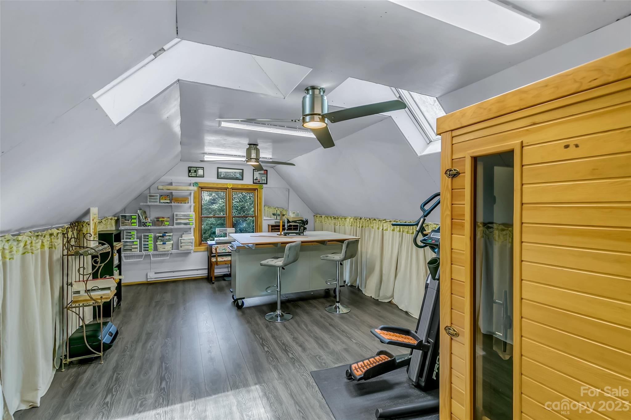 449 Old Powell Road Brevard, NC 28712 - Photo 35 of 48 a room with lots of wooden furniture and wooden floor