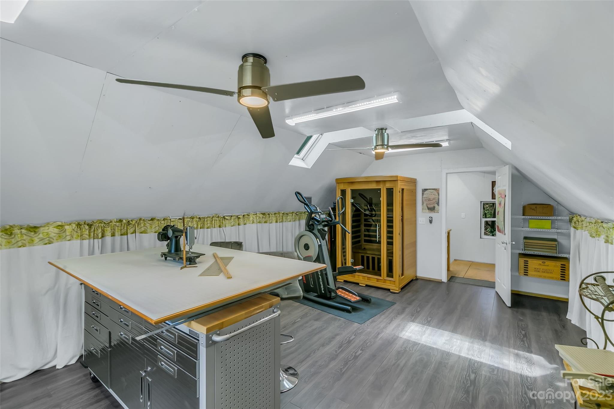 449 Old Powell Road Brevard, NC 28712 - Photo 36 of 48 a view of a room that has a bed and a table in it