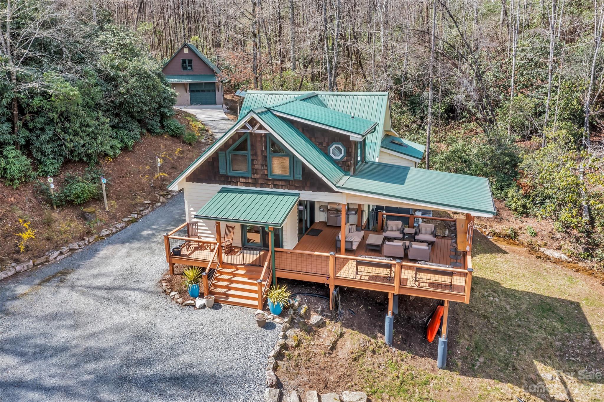 449 Old Powell Road Brevard, NC 28712 - Photo 38 of 48 a view of a small house with roof deck