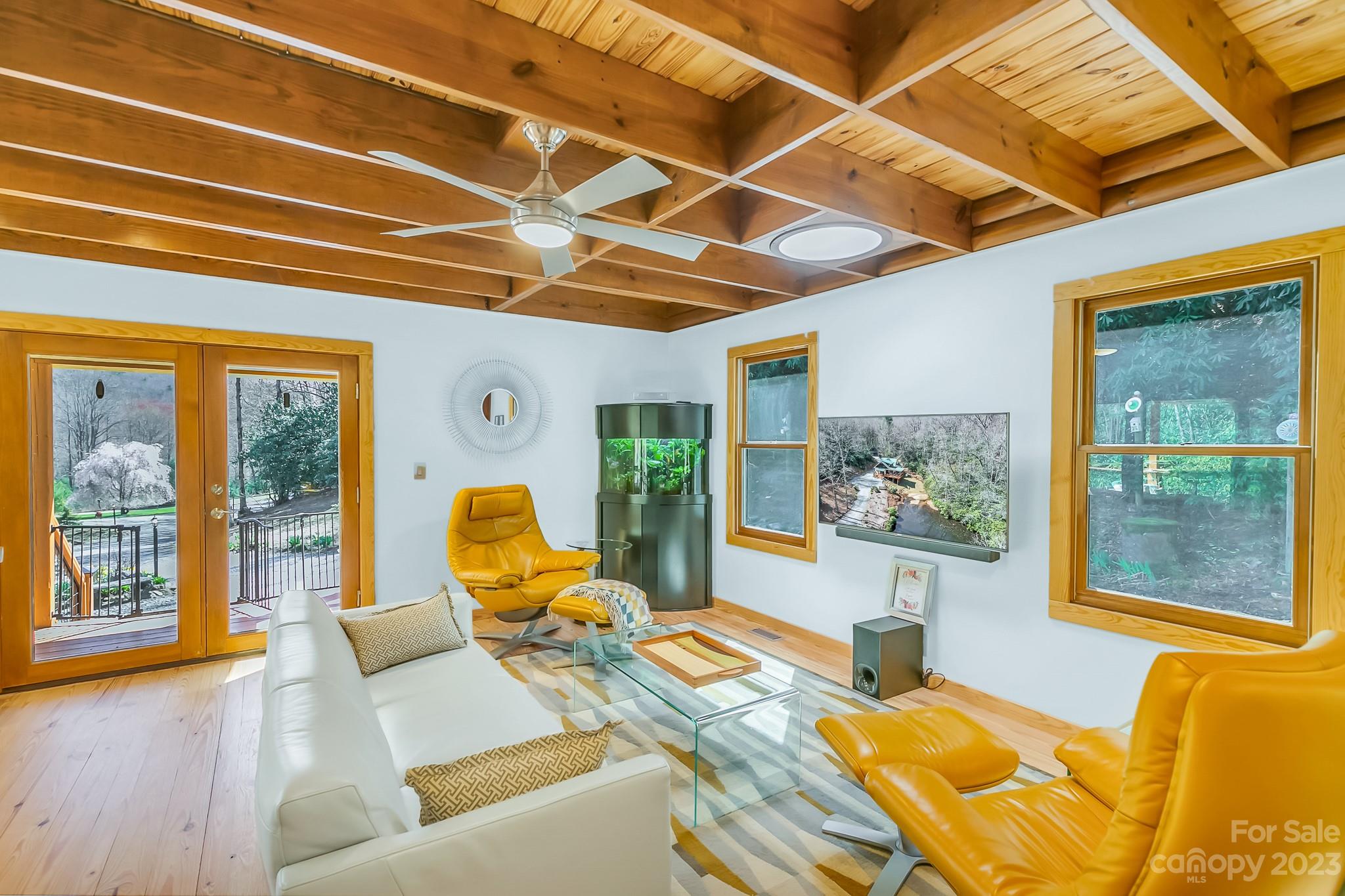 449 Old Powell Road Brevard, NC 28712 - Photo 4 of 48 a bed room with a bed and wooden floor