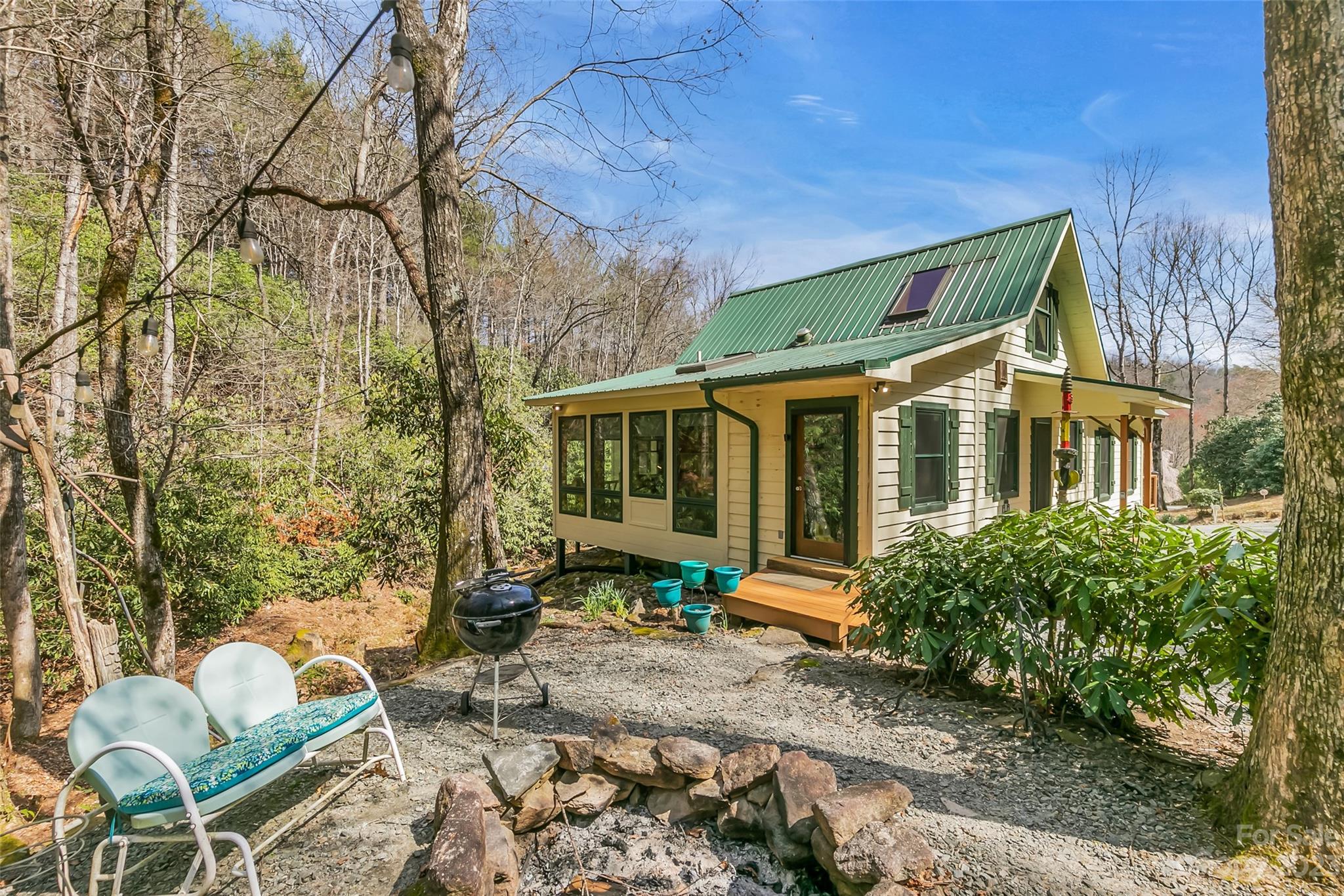 449 Old Powell Road Brevard, NC 28712 - Photo 41 of 48 a front view of a house with outdoor seating