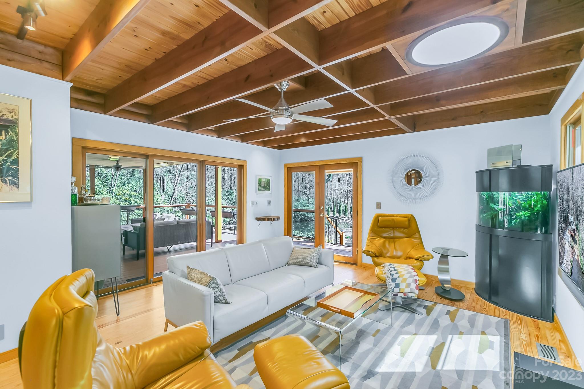 449 Old Powell Road Brevard, NC 28712 - Photo 5 of 48 a living room with furniture and a floor to ceiling window