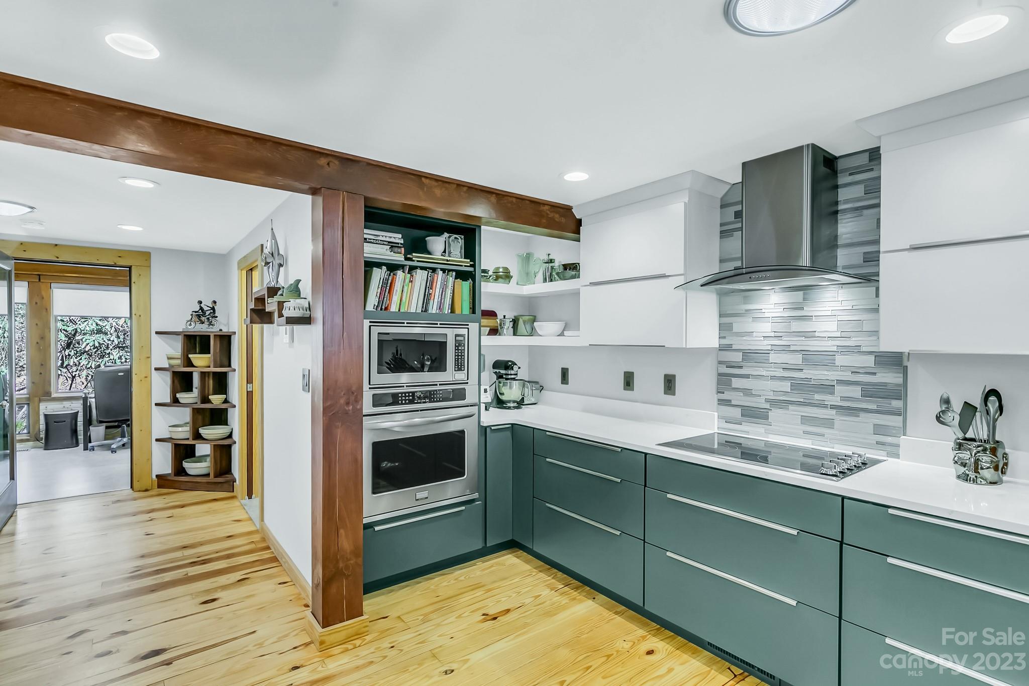 449 Old Powell Road Brevard, NC 28712 - Photo 9 of 48 a kitchen with stainless steel appliances granite countertop a refrigerator and a sink