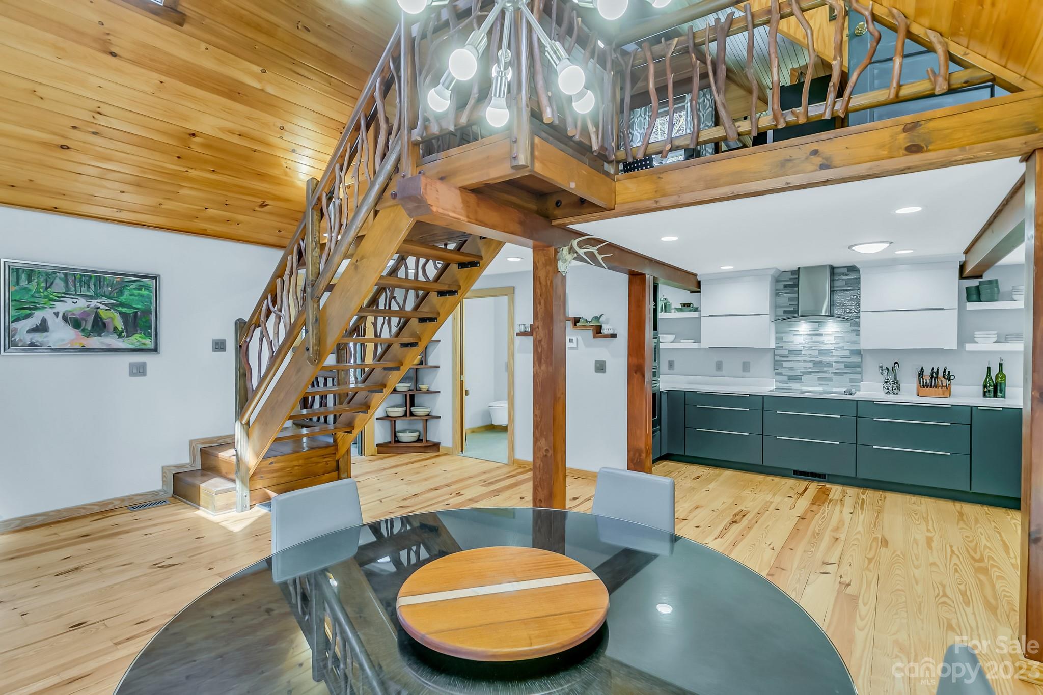 449 Old Powell Road Brevard, NC 28712 - Photo 10 of 48 a view of a living room and chandelier