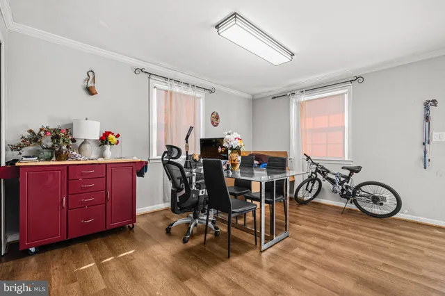 a view of a dining room with furniture window and wooden floor