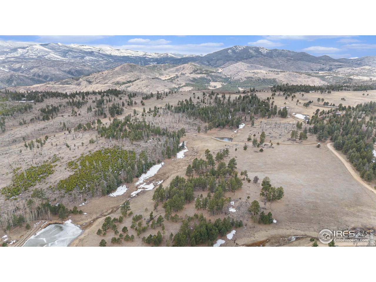 0 Tip Top Road Bellvue, CO 80512 - Photo 3 of 18 a black and white photo of a lake
