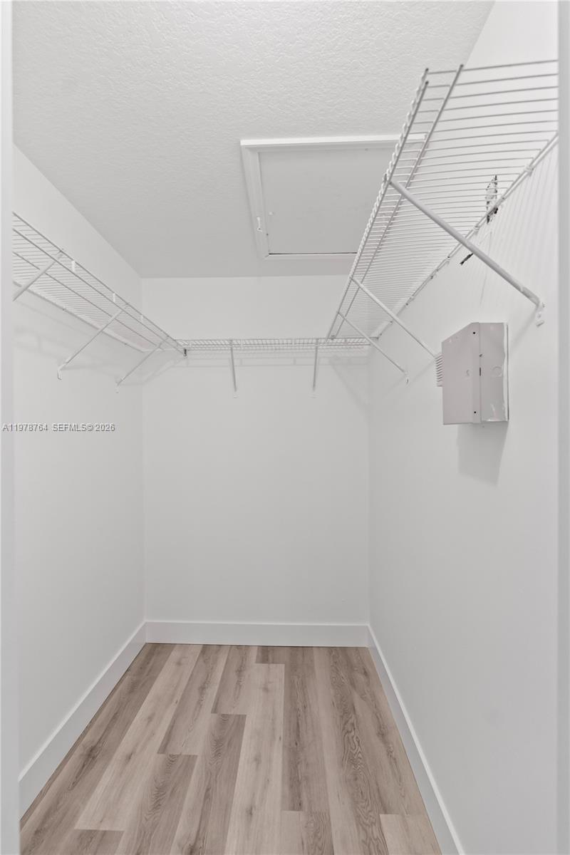 2930 Southeast 12th Road, Unit 20431 Homestead, FL 33035 - Photo 12 of 33 a view of a room with racks on the wall