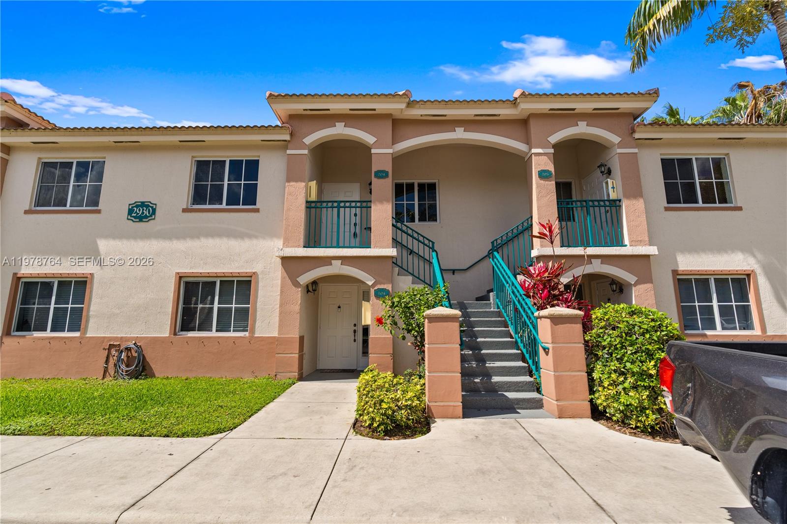 2930 Southeast 12th Road, Unit 20431 Homestead, FL 33035 - Photo 16 of 33 a front view of a house with garden