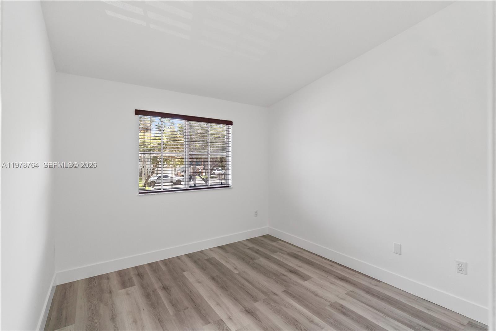 2930 Southeast 12th Road, Unit 20431 Homestead, FL 33035 - Photo 18 of 33 an empty room with a window