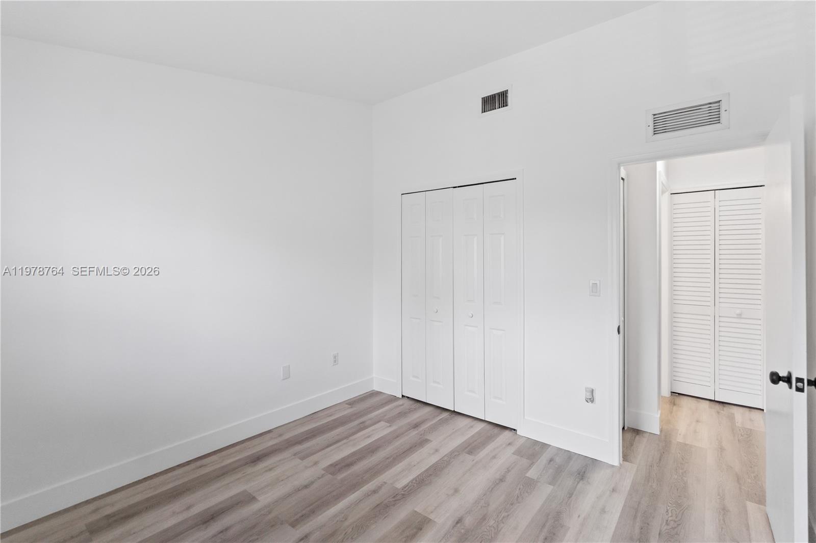 2930 Southeast 12th Road, Unit 20431 Homestead, FL 33035 - Photo 19 of 33 a view of a room with wooden floor