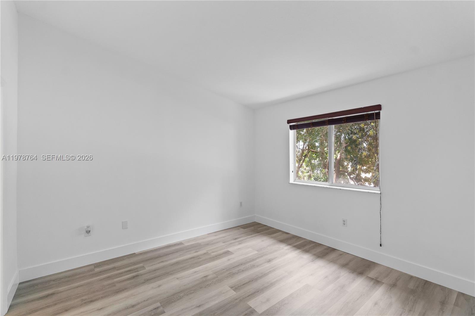 2930 Southeast 12th Road, Unit 20431 Homestead, FL 33035 - Photo 22 of 33 an empty room with a window