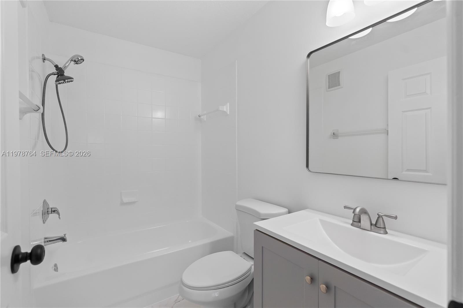 2930 Southeast 12th Road, Unit 20431 Homestead, FL 33035 - Photo 25 of 33 a bathroom with a granite countertop sink a toilet and shower