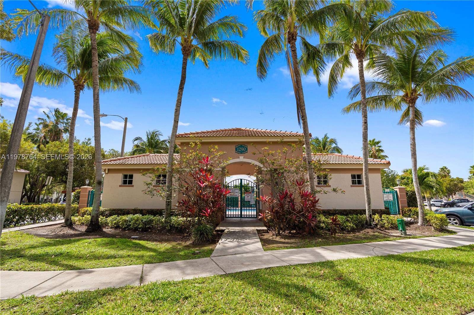 2930 Southeast 12th Road, Unit 20431 Homestead, FL 33035 - Photo 26 of 33 a front view of a house with garden
