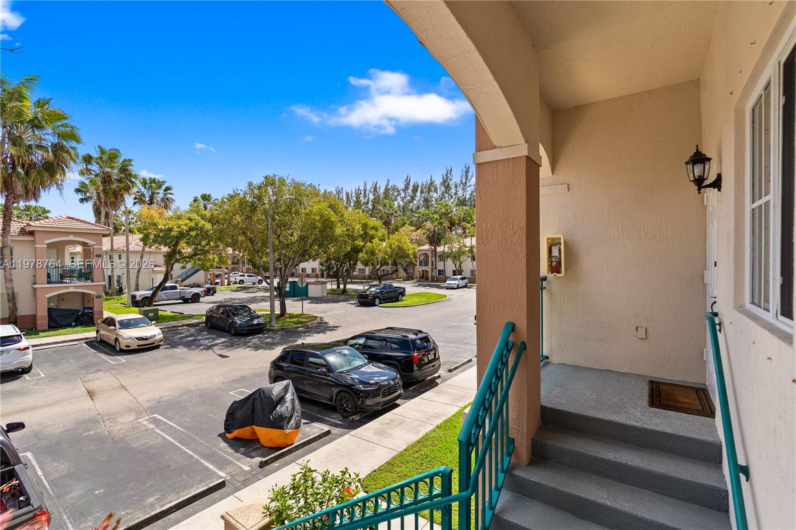 2930 Southeast 12th Road, Unit 20431 Homestead, FL 33035 - Photo 28 of 33 a view of a patio with table and chairs and a barbeque
