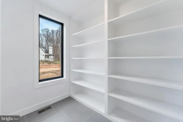 a view of an entryway with wooden floor and door