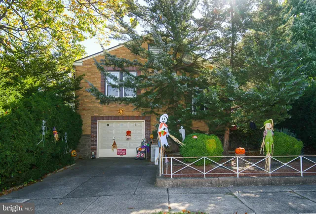 a view of backyard with table and chairs and a barbeque