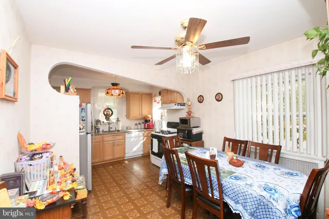 a kitchen with a sink cabinets and a stove