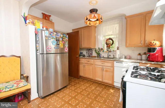 a bedroom with a bed and a flat tv screen on wall