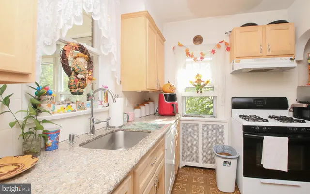 a bathroom with a sink toilet and mirror