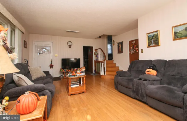 a kitchen with stainless steel appliances a stove a sink and a microwave