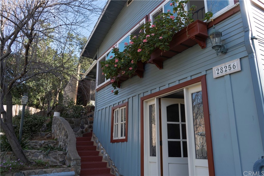 a view of a house with a tree