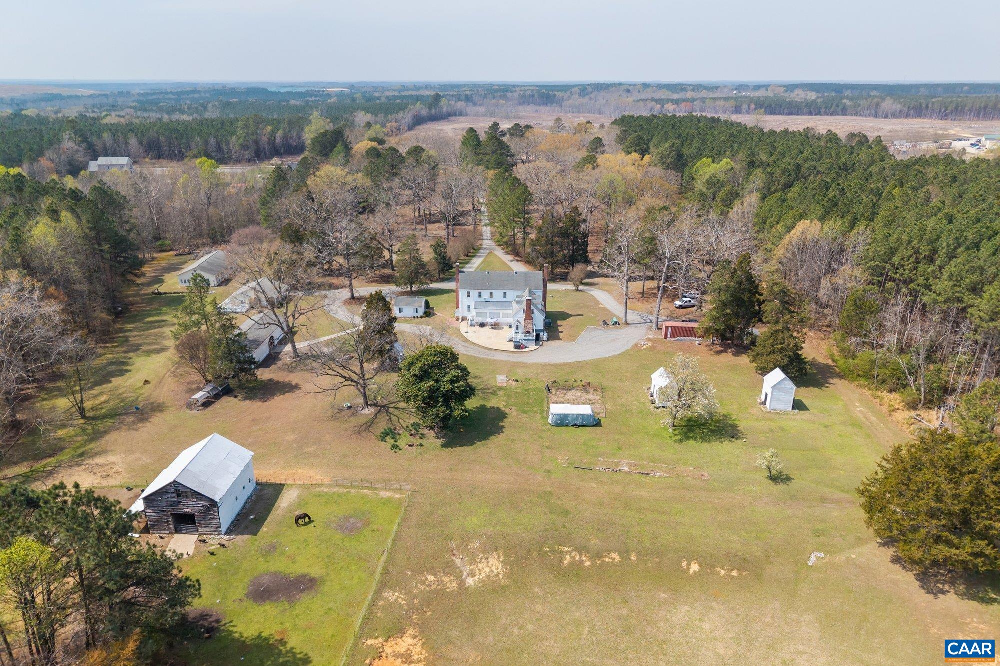 14910 Western Mill Road Lawrenceville, VA 23868 - Photo 5 of 73 an aerial view of a house with a swimming pool