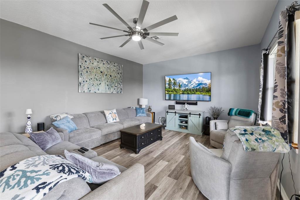 4464 Neptune Drive Hernando Beach, FL 34607 - Photo 13 of 47 a living room with furniture a bed and a window