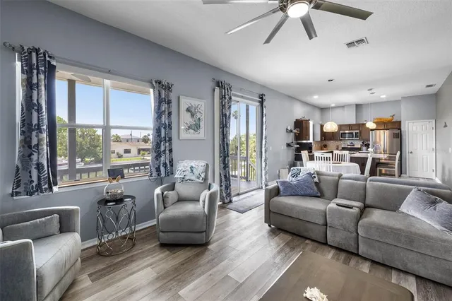 a view of a livingroom with furniture and a flat screen tv