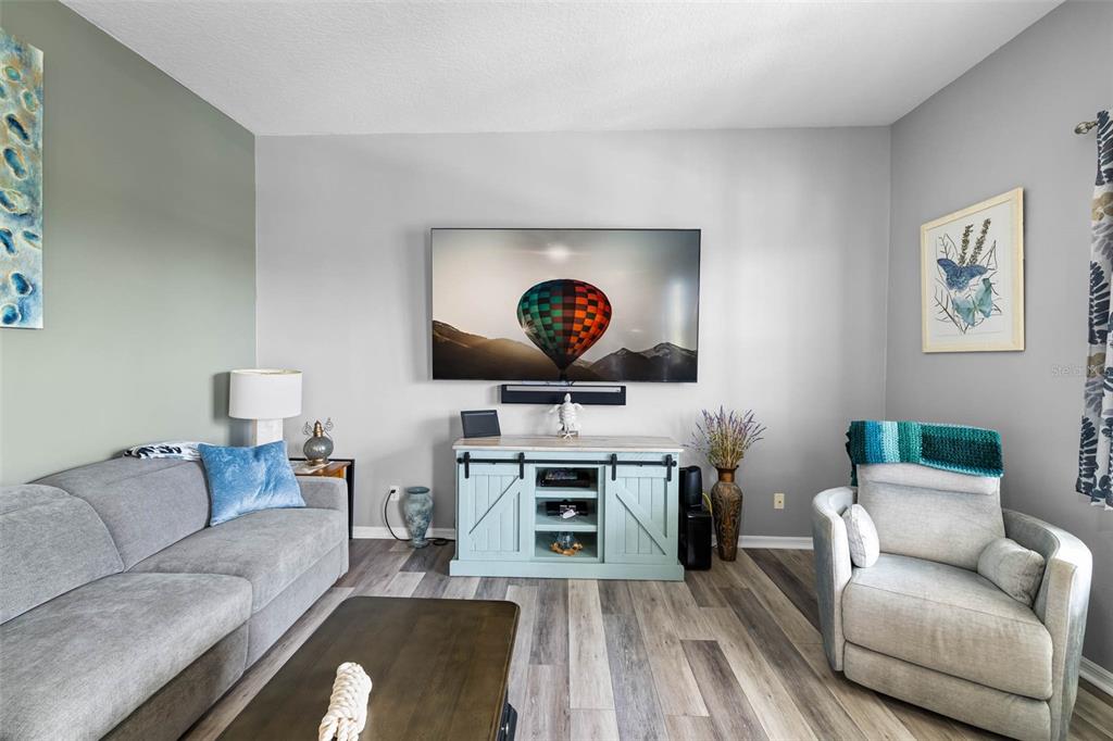 4464 Neptune Drive Hernando Beach, FL 34607 - Photo 15 of 47 a living room with furniture and a wooden floor