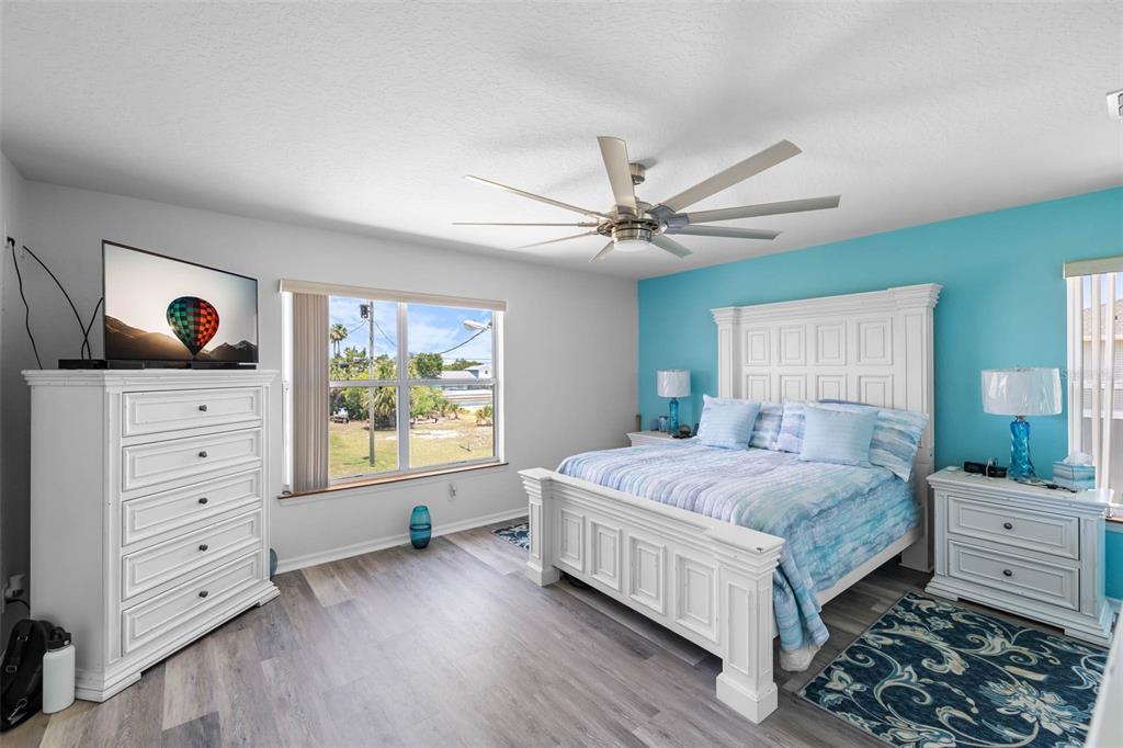 4464 Neptune Drive Hernando Beach, FL 34607 - Photo 17 of 47 a bedroom with a bed and a window